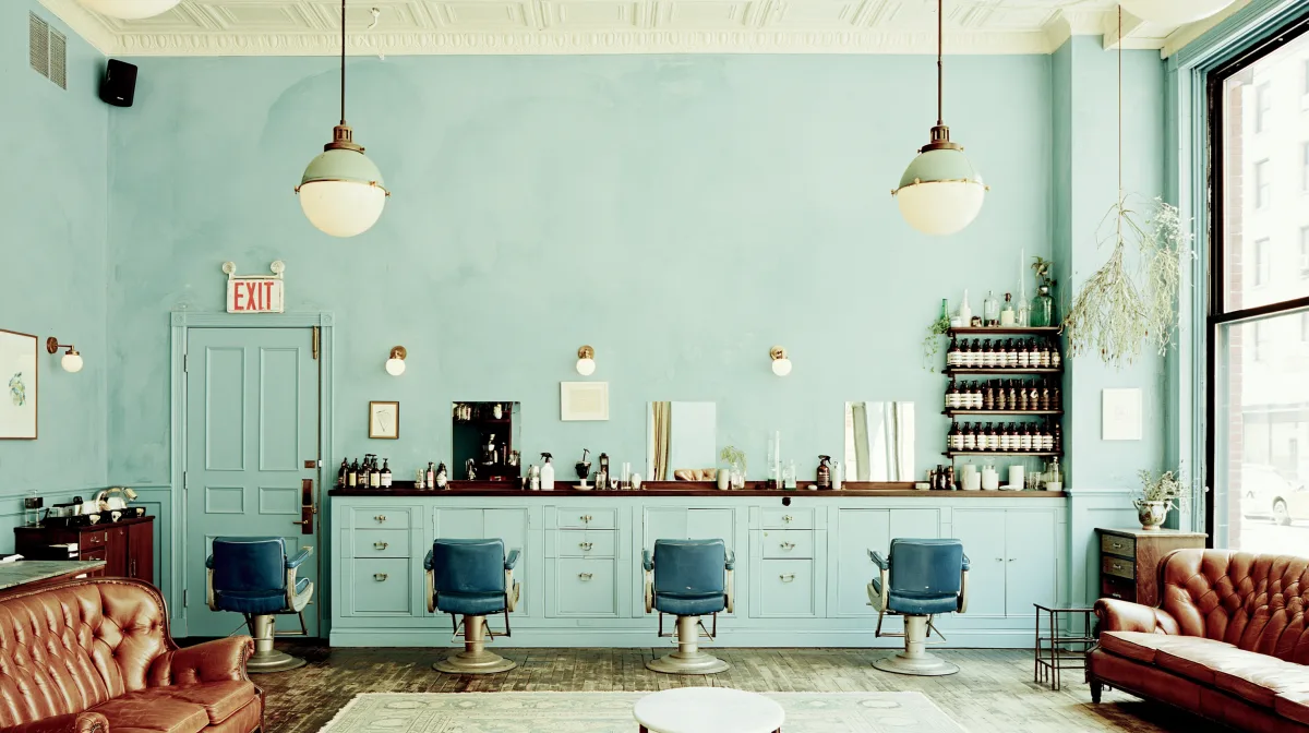 The Crmaesthetics salon interior with duck-egg walls and styling chairs in Hornchurch